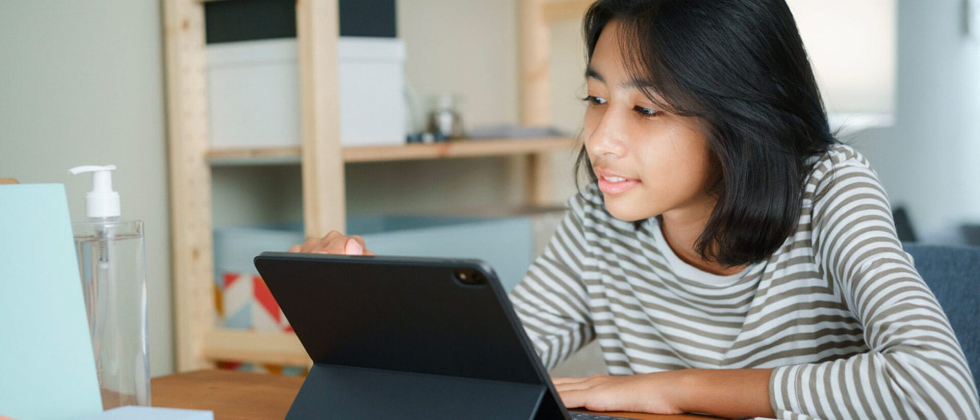 Student working on her tablet